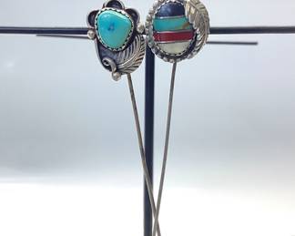 TWO STERLING SILVER SOUTHWEST STICK PINS STERLING SILVER STICK PINS FEATURING SOUTHWESTERN AND NATIVE AMERICAN THEME. TOTAL WEIGHT 6 GRAMS
