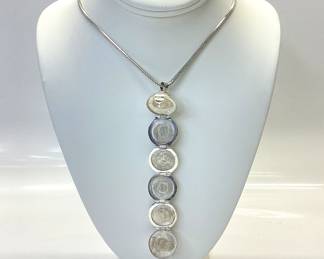 STERLING SILVER BALL LOCKET WITH 30 INCH CHAIN MEXICO STERLING SILVER BALL LOCKET OPENS 5 INCHES TO EXPOSE 6 SPACES. IT IS HUNG BY A 30 INCH BRAIDED HERRINGBONE NECKLACE