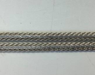 STERLING SILVER BALL LOCKET WITH 30 INCH CHAIN MEXICO STERLING SILVER BALL LOCKET OPENS 5 INCHES TO EXPOSE 6 SPACES. IT IS HUNG BY A 30 INCH BRAIDED HERRINGBONE NECKLACE