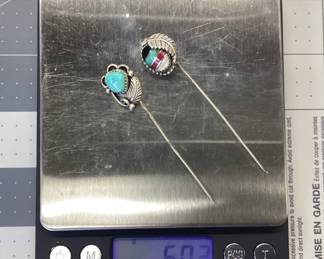 TWO STERLING SILVER SOUTHWEST STICK PINS STERLING SILVER STICK PINS FEATURING SOUTHWESTERN AND NATIVE AMERICAN THEME. TOTAL WEIGHT 6 GRAMS