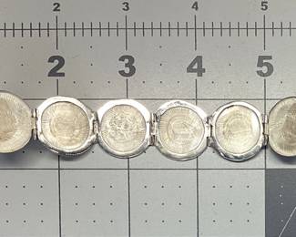 STERLING SILVER BALL LOCKET WITH 30 INCH CHAIN MEXICO STERLING SILVER BALL LOCKET OPENS 5 INCHES TO EXPOSE 6 SPACES. IT IS HUNG BY A 30 INCH BRAIDED HERRINGBONE NECKLACE