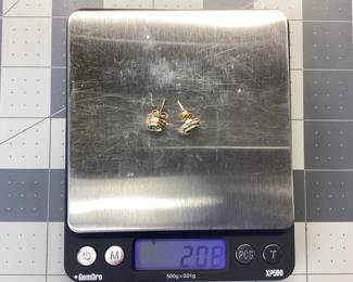 14K EMERALD EARRINGS 14K EARRING SETTINGS WITH TWO 1/3 CARAT ROUND EMERALDS. WEIGHT IS 2.08 GRAMS