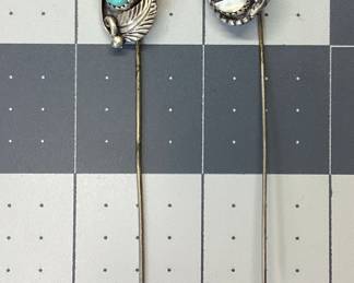 TWO STERLING SILVER SOUTHWEST STICK PINS STERLING SILVER STICK PINS FEATURING SOUTHWESTERN AND NATIVE AMERICAN THEME. TOTAL WEIGHT 6 GRAMS