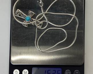STERLING SILVER CHAIN AND CROSS PENDANT 24 INCH SNAKE CHAIN WITH 1.5 INCH TALL CROSS FEATURING A ROUND CABOCHON TURQUOISE