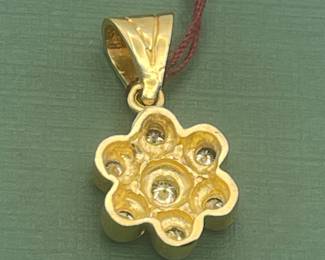 14 kt yellow gold pendant featuring approximately 0.5 carats of diamonds