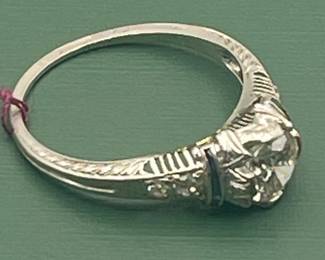 Antique Platinum diamond ring featuring an approximate 1/2 carat diamond center with accent stones. Size 6 ¼