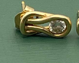 14 kt yellow gold and diamond earrings.  Carat weight is approximately 0.5 carats.