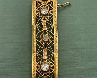 Antique 18kt yellow gold filigree bracelet featuring approximately 1.5 carats of diamonds and a box clasp adorned with a smaller diamond.