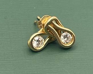 14 kt yellow gold and diamond earrings.  Carat weight is approximately 0.5 carats.