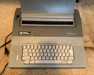 The image shows a Smith Corona DeVille 510 portable electronic typewriter. 
