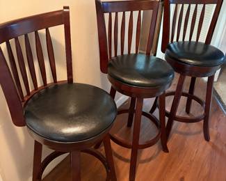 Black leather swivel bar stools