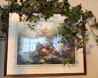 This is a framed art print of Everett's Cottage by Thomas Kinkade. 

