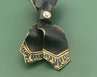 Antique 14 kt yellow gold, black enamel and diamond pendant.