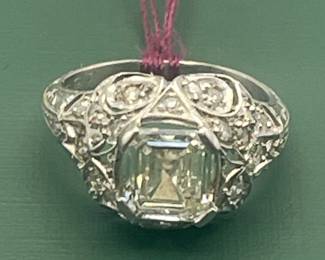 Custom designed platinum ring circa 1915 - 1920 featuring a very rare Asscher-cut, 1.05 carat center diamond and accented with approximately 0.25 carats of smaller accent diamonds.  Size 3 1/2