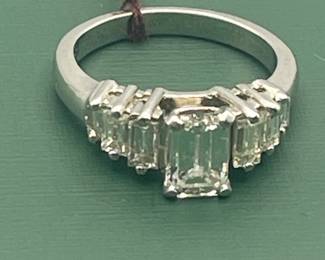 1940's / 1950's platinum ring featuring a 1.02 carat emerald cut center diamond and 0.6 carats of side diamonds.  Diamonds are estimated to be VSG.  Size 5 1/2