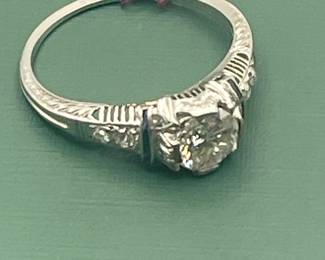 Antique Platinum diamond ring featuring an approximate 1/2 carat diamond center with accent stones.  Size 6 1/4