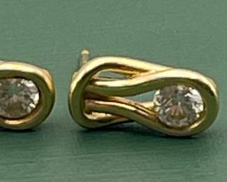14 kt yellow gold and diamond earrings.  Carat weight is approximately 0.5 carats.