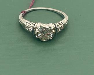 Antique Platinum diamond ring featuring an approximate 1/2 carat diamond center with accent stones.  Size 6 1/4