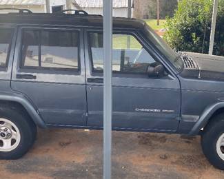 2001 Jeep Cherokee (178000 miles per owner. Has been parked and needs a new battery. Sold as is.)
