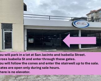 Park in the dirt lot, walk across the street to this garage.