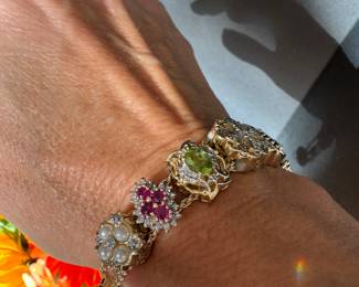 #120 - Victorian style slider bracelet. 14kt gold. 44.6 grs. 3 slides are 10kt gold the rest 14kt gold including setting. 7 3/4 " L. 