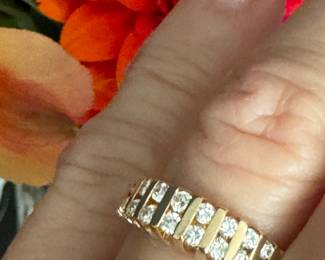 #103 - $475 - 1 ctw channeled band 14kt gold. 4.8grs. size 6. 