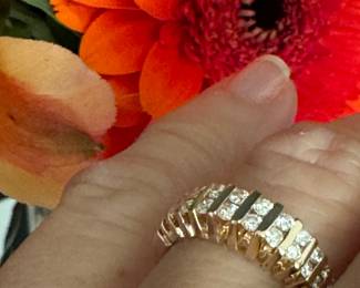 #103 - $475 - 1 ctw channeled band 14kt gold. 4.8grs. size 6. 