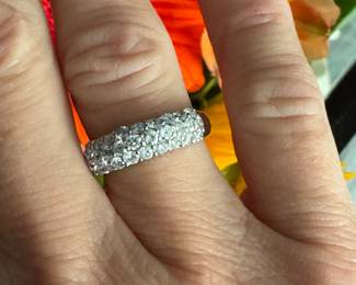 #110 - $1000. Approx 1 ctw platinum band with pave diamonds. 7.6 grams. size 6. 