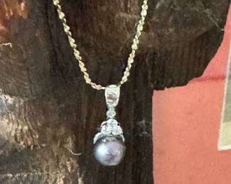 #3- $225- 18kt white gold and black sea pearl (chain not included)