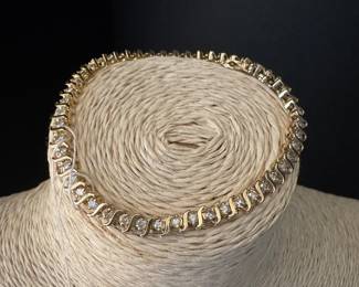 13. - $700 10kt Tennis Bracelet. 2 ctw diamonds 8.6 gram
