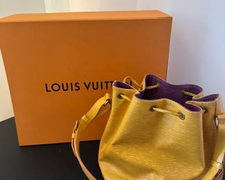 #56 - $595 Louis Vuitton yellow Epi bucket bag 8"x10" 