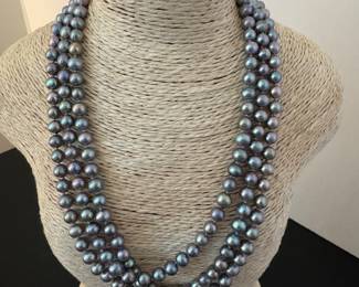 #45 - $140 - Three strands of black pearls. 18"L