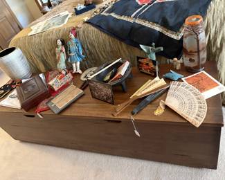 Asian goodies atop a long contemporary chest with simple clean lines.