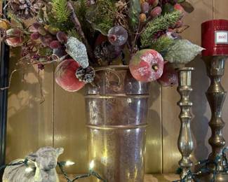 Sweet rather primitive lamb with floral display.