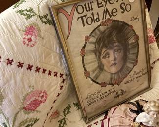 Framed sheet music in the doll room.