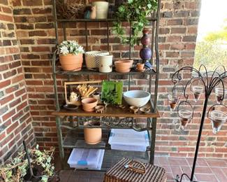 Ah...we  are outdoors now.  This is a  good baker's rack filled with small items of interest.