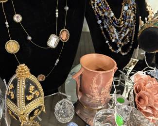 Just a sampple of some of the treasures we have.  Stangl bird, Roseville 2-handled vase, signed crystal egg, and nice quality costume jewelry.