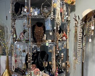 This corner rack is completely stuffed with costume jewelry.  We had no other way to display the long necklaces other than to hang them.  Lots os Chicos items and other name brands.