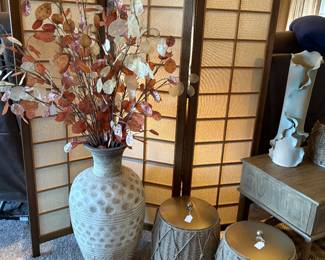 A grouping of decorative pots.  The vase on the right is a very cool piece of pottery that is signed by the artist.