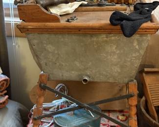 This is a wonderful and interesting item.  We have never seen one that is comparable.  It appears to be a salesman's sample washing tub with wringer.   Very fun indeed!