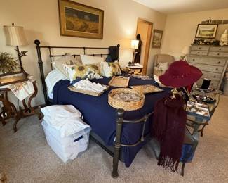 The wrought iron king bed.  We are sorting jewelry in this room as well.