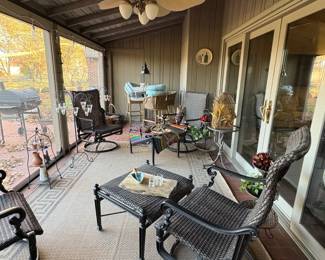 A view of the back porch with good quality outdoor furniture.