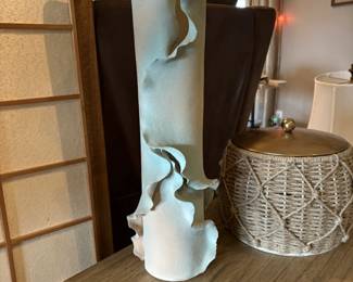 This is an extrodinary large signed pottery vase with a cool ruffled edge .  Wow.