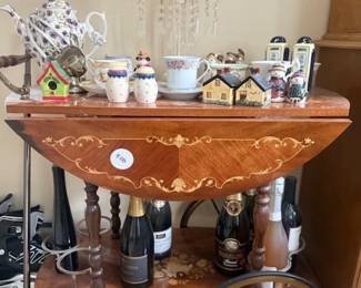 bar cart, teapot lamp, teacups, teapots