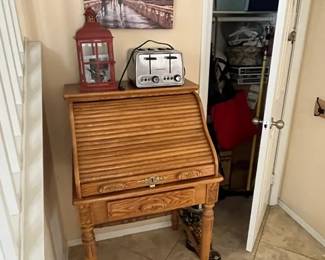 Secretary's desk; toaster; art; decor; clothing