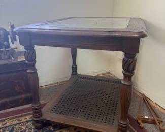 Wood end table with glass top and caning bottom 