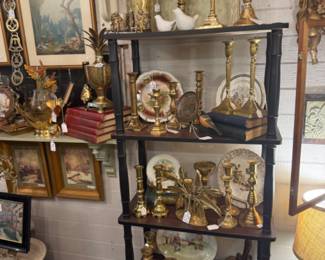 brass candlesticks, old books, cherubs, framed art