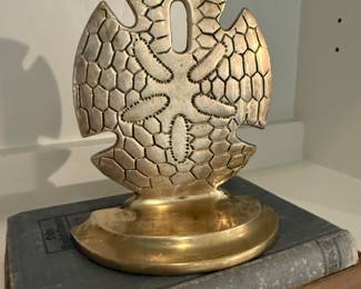 Vintage brass sand dollar book end