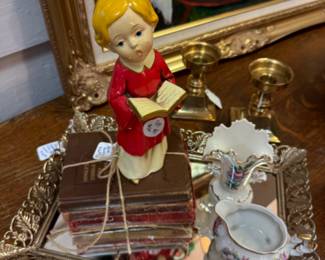 Vintage Caroler Figurine, chunky brass candlesticks, vanity MCM Hollywood mirror, vintage book bundle