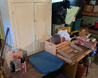 Basement, nice luggage in black bags and apothecary cabinet